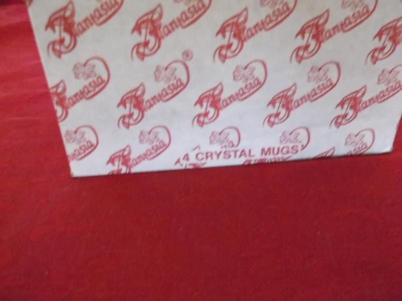 4 Crystal mugs new in box....
