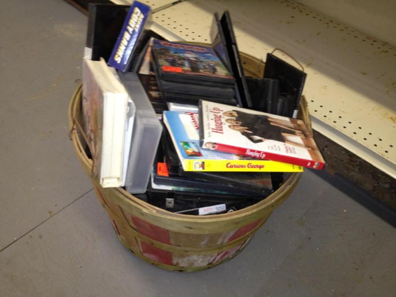 Barrel of empty DVD and VHS cases
