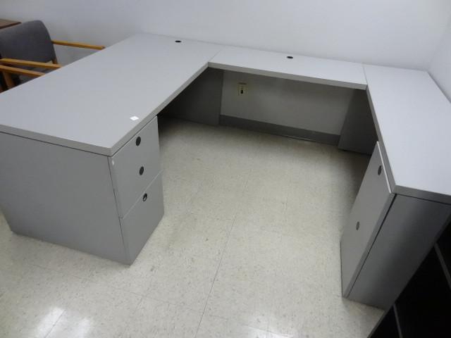 lot 1 image: U shaped laminate desk. 3 drawers a...