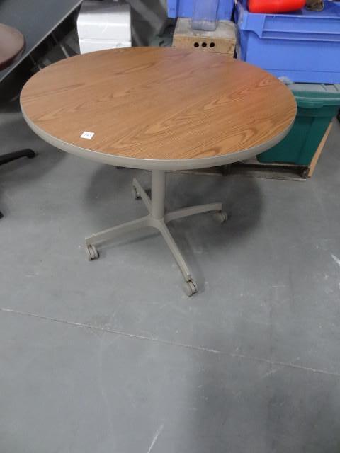 lot 103 image: 36" round table on wheels...