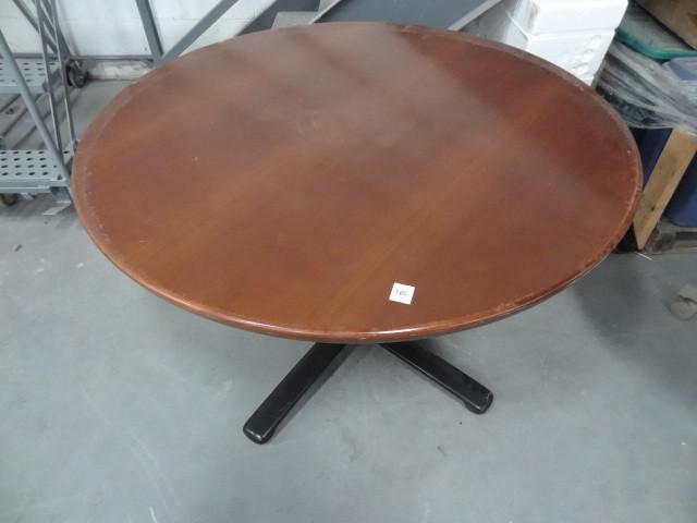 lot 104 image: 42" round table with metal bas...