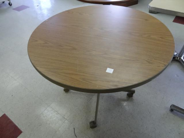lot 17 image: 36" round table on wheels...