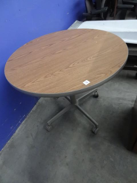 lot 228 image: 36" round table on wheels...