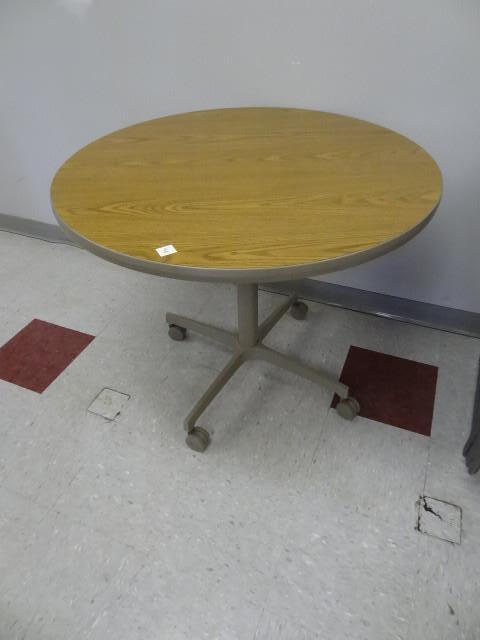 lot 40 image: 36" round table on wheels...