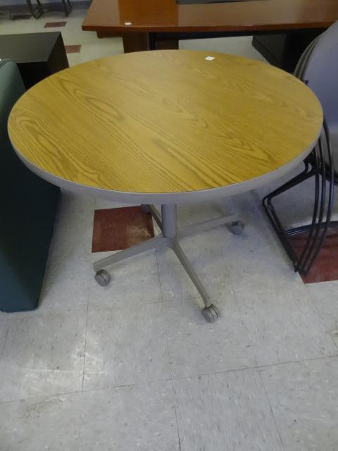 lot 48 image: 36" round table on wheels...
