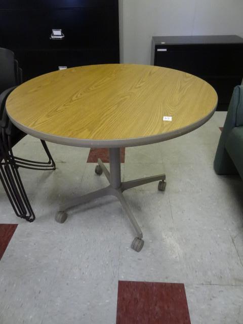 lot 85 image: 36" round table on wheels...