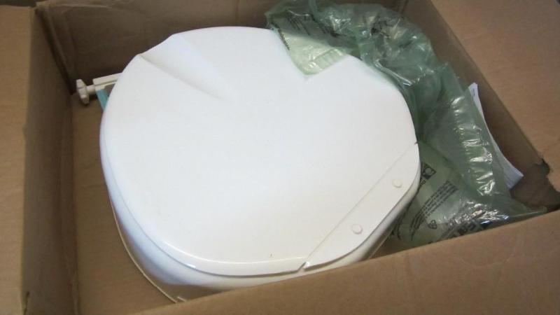 lot 34 image: raised toilet seat...