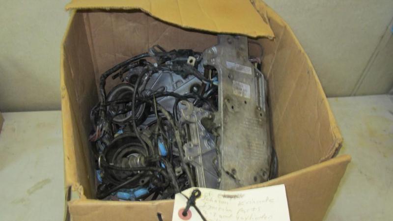 lot 76 image: box of Johnson Evinrude parts...