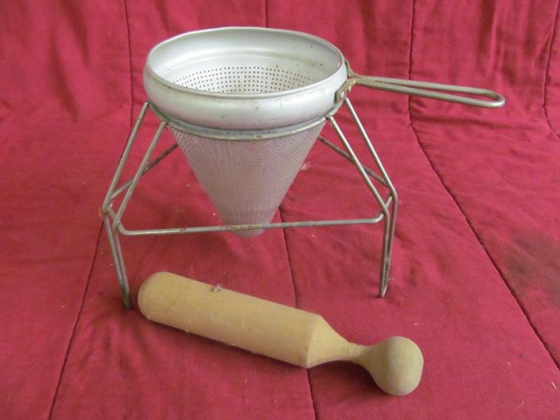 Collander on Stand and Wood Masher...