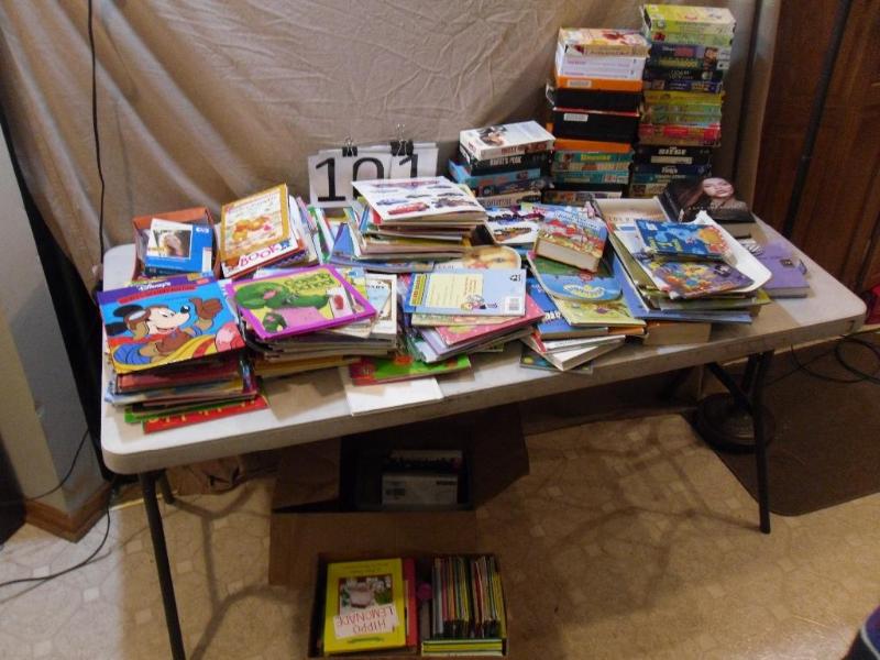 lot 101 image: Large Lot of Books and VHS Movies. ...