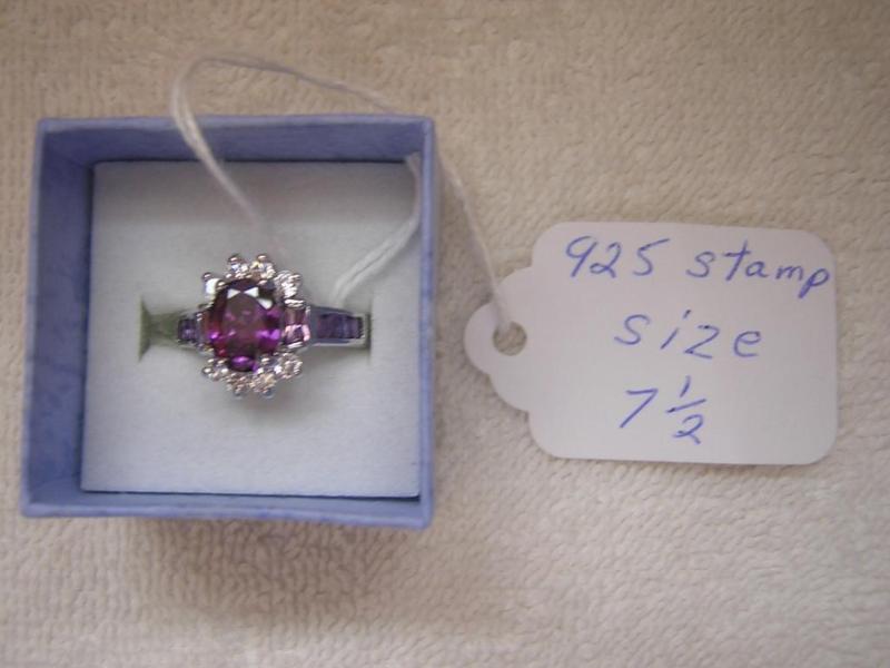 lot 18 image: Gorgeous silver ring with purple co...