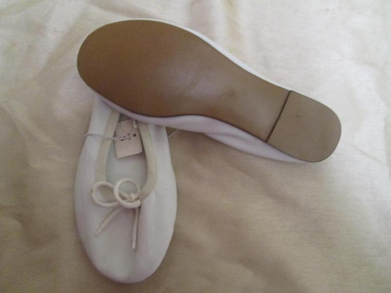 Exhillleration white ballet slipper...