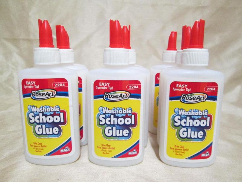 9 new bottles of white school glue....