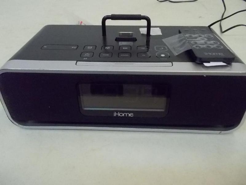 lot 14 image: iHome dock with charger and remote....