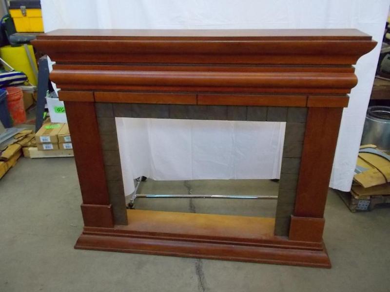 lot 4 image: Fireplace mantle with maple stain a...