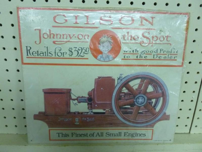 Gilson embossed metal sign that mea...