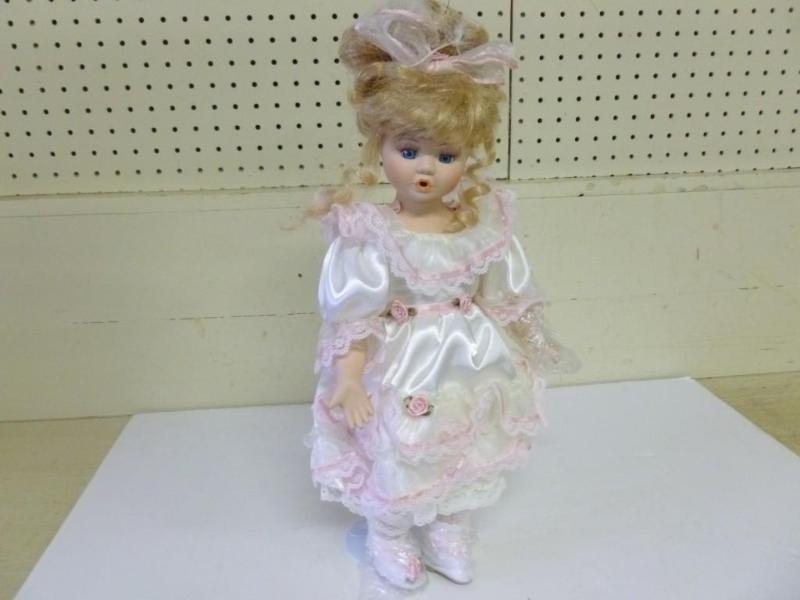 Beautiful porcelain doll with stand...
