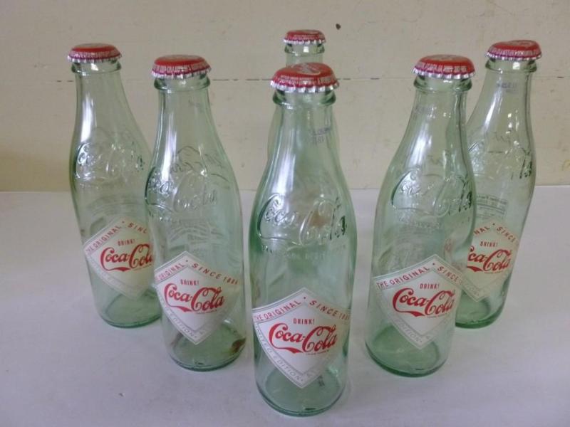 Lot of six collectible Coca-Cola pa...
