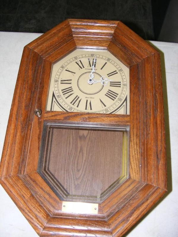 lot 186 image: Wall Clock, by Howard Miller Has a ...