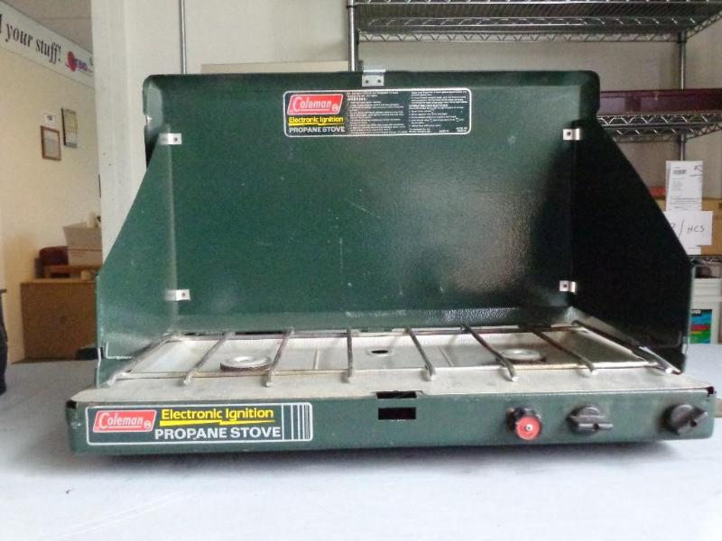 lot 1 image: Coleman 2 burner camping stove prop...