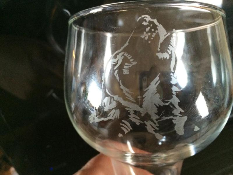 wine glass with a etched picture of...