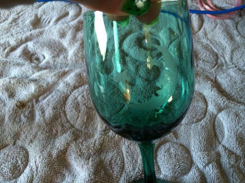 wine glass with a etched picture of...