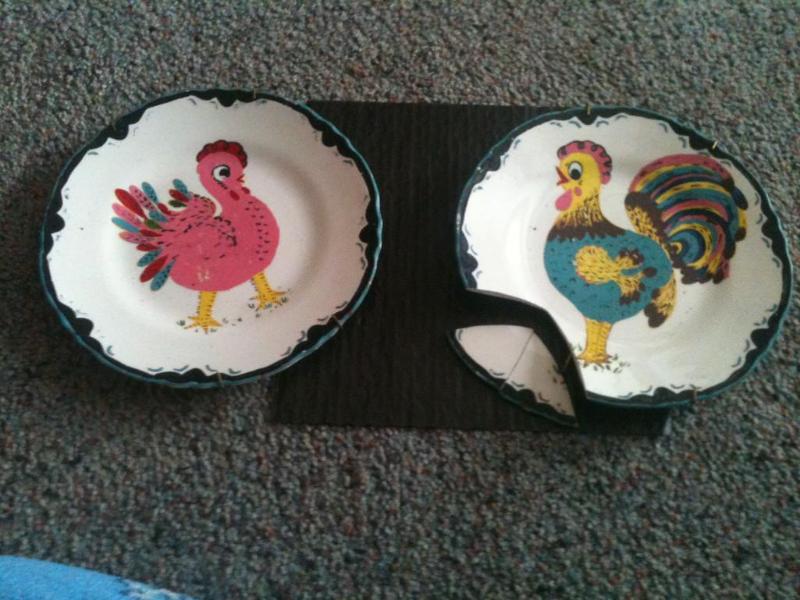 hand painted plates one is broke an...