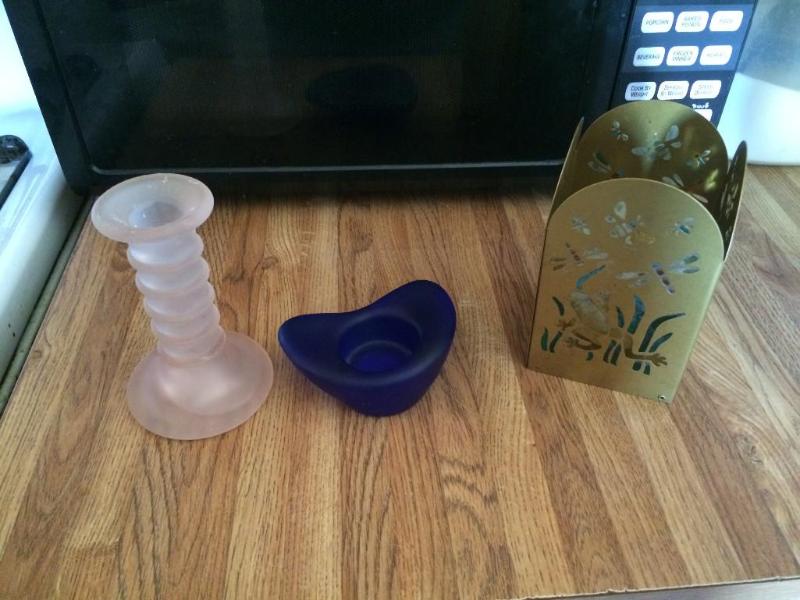 one blue and one peach candle holde...