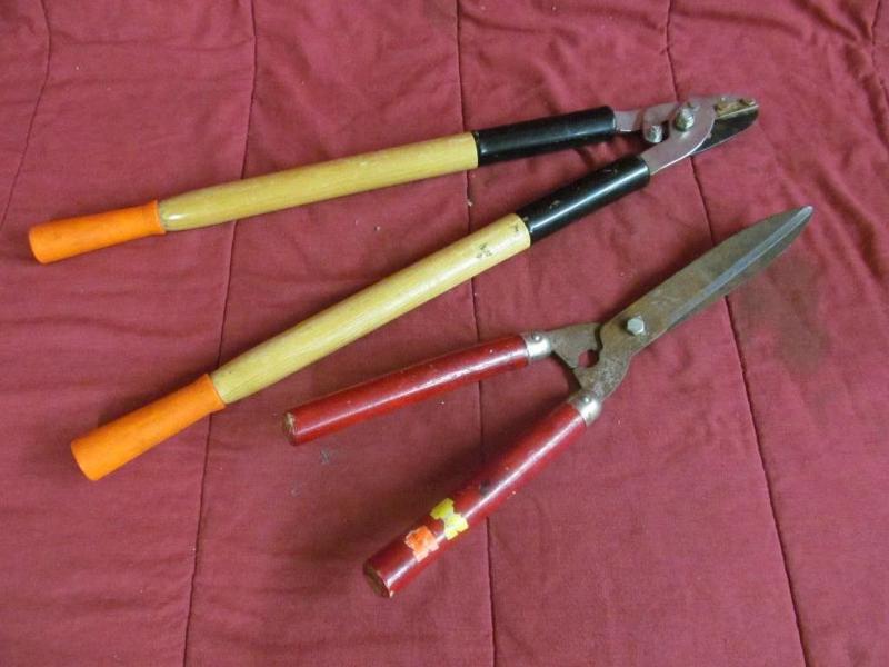 2 Hedge Cutters with Red Handles...
