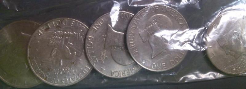 BAG OF 5 IKE DOLLARS...