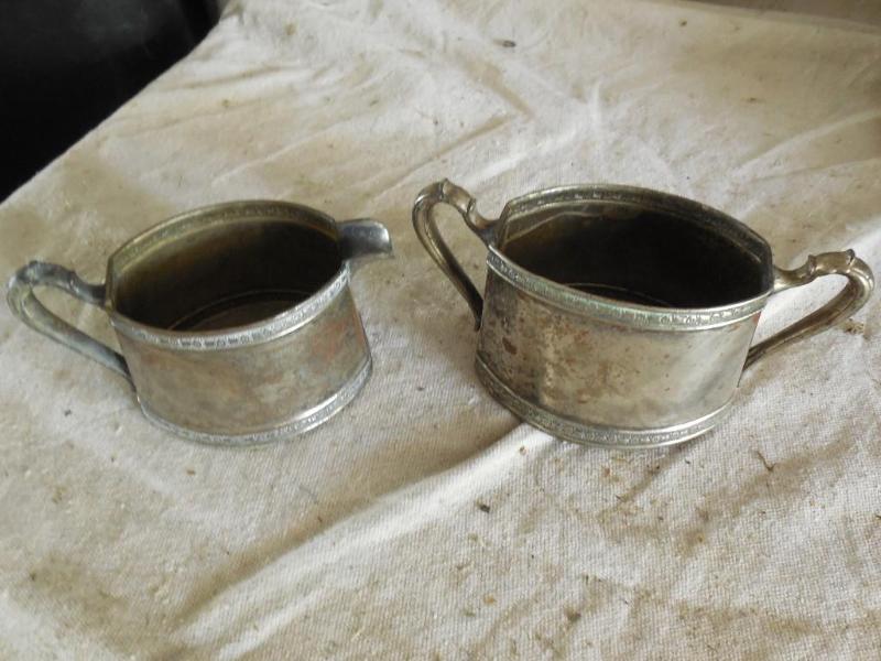 Old metal containers sugar and crea...