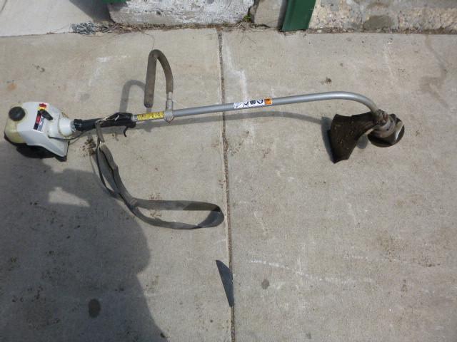 lot 11 image: Ryobi Weed Whip 31 cc, has compress...