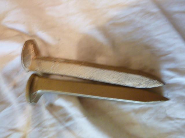 lot 149 image: 2 Golden Rail Road Spikes...