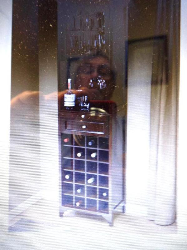 MYHOME TALL WINE CABINET. Bidder is...