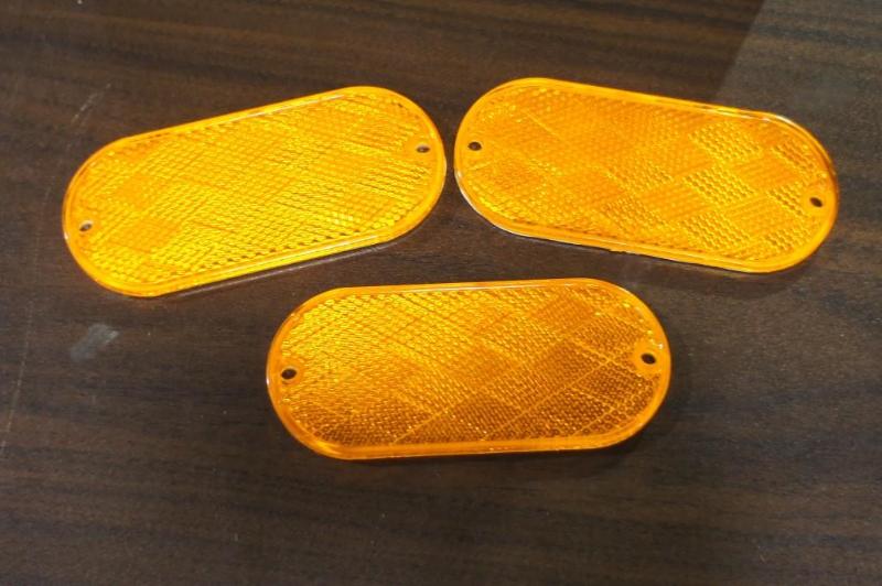 Large lot of orange oval reflectors...