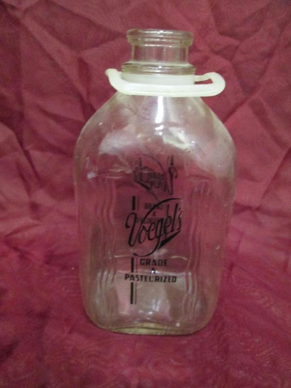lot 19 image: Clear glass half gallon milk bottle...