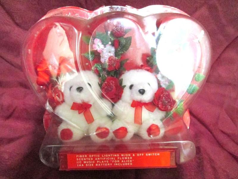 lot 21 image: Teddy bears with flowers and fiber ...