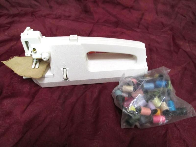 lot 27 image: Nice hand held sewing machine with ...