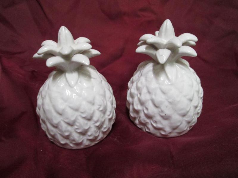 lot 33 image: White salt and pepper shakers in th...