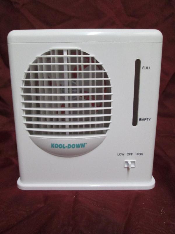 lot 77 image: Battery operated Kool-Down fan with...