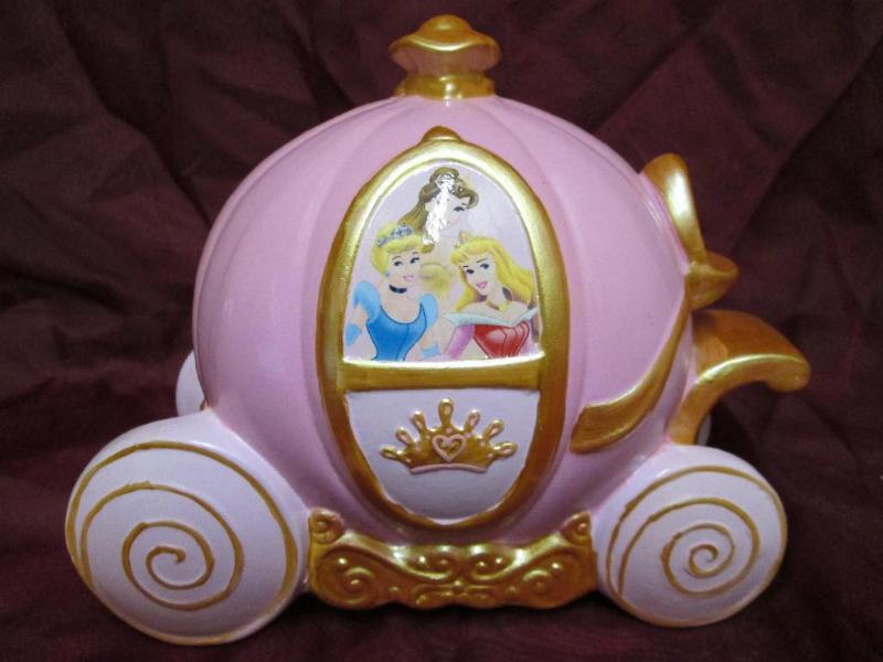 lot 85 image: Cindarella coach coin bank. Appears...
