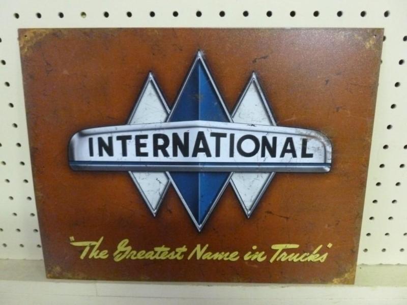 lot 54 image: International metal sign that measu...
