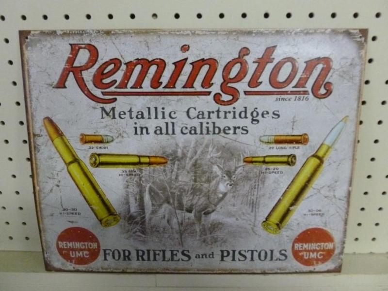 lot 56 image: Remington metal sign that measures ...