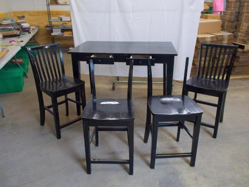 Table and 4 chairs. Table is tall i...