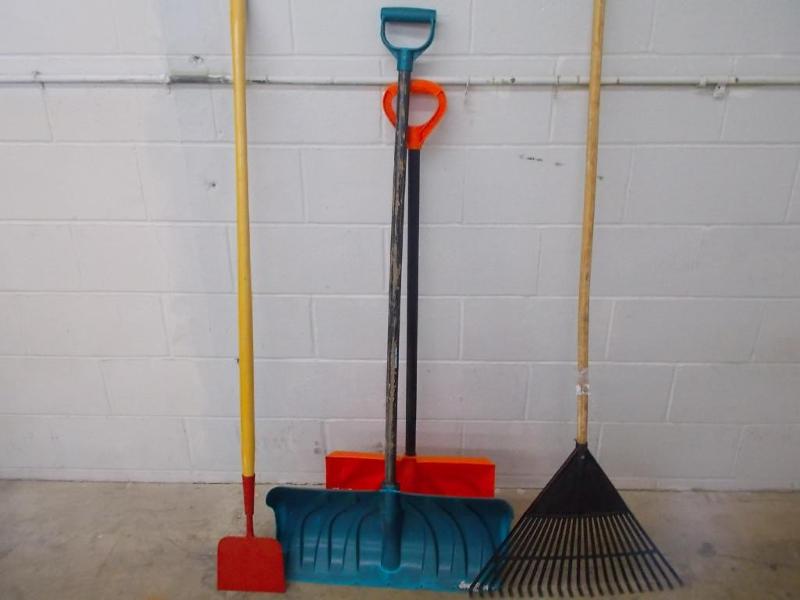 2 snow shovels, 1 grass rake and 1 ...