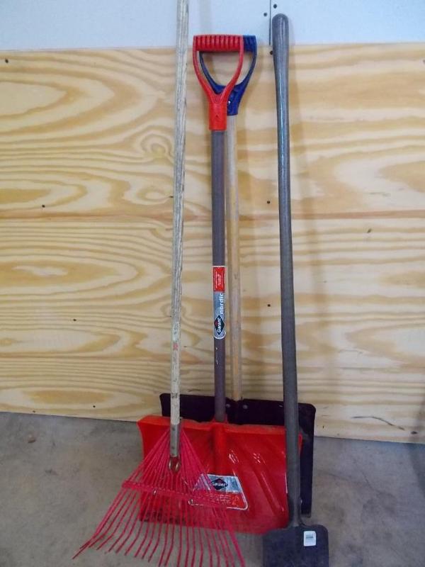 2 snow shovels, 1 grass rake and 1 ...