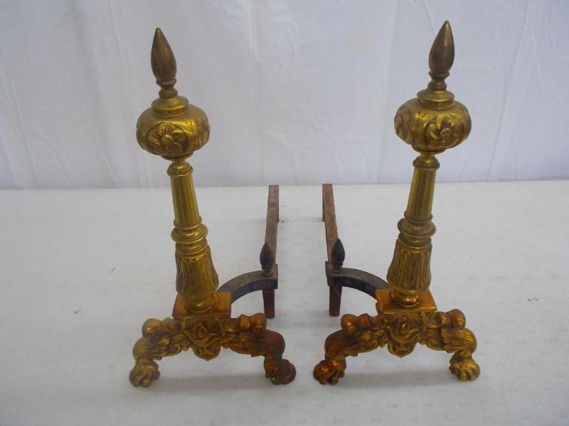 A large pair of fireplace andirons....
