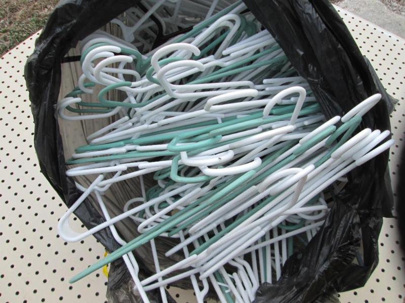 Large bag of plastic hangers, white...