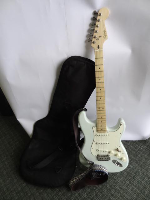 lot 85 image: Squier Stratocaster Fender with Cas...