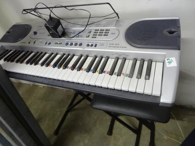 lot 301 image: Casio Electric Keyboard LK-45 Stand...